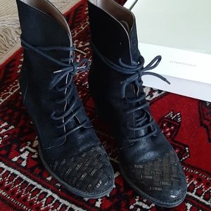 Mid-calf Boots leather upper. Non-slip sole.